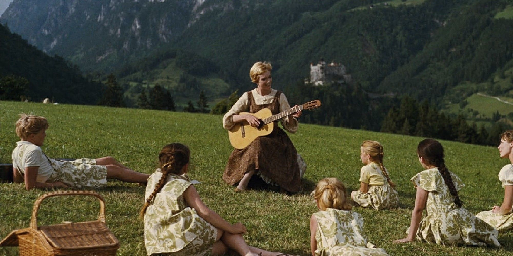 Julie Andrews playing guitar in a field in 'The Sound of Music' (1965)