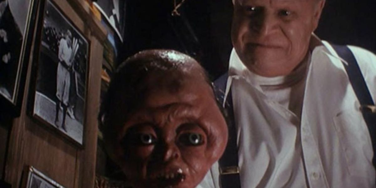 Mr. Ingels, played by Don Rickles, holding his Siamese twin dummy in Tales from the Crypt episode "The Ventriloquist's Dummy."