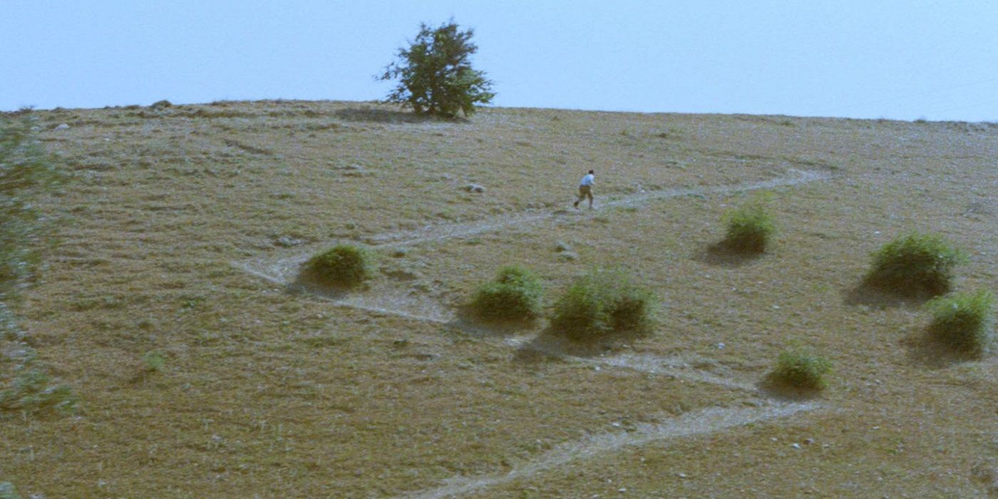 A young boy running up a dirt path in 'Where is the Friend's Home?'