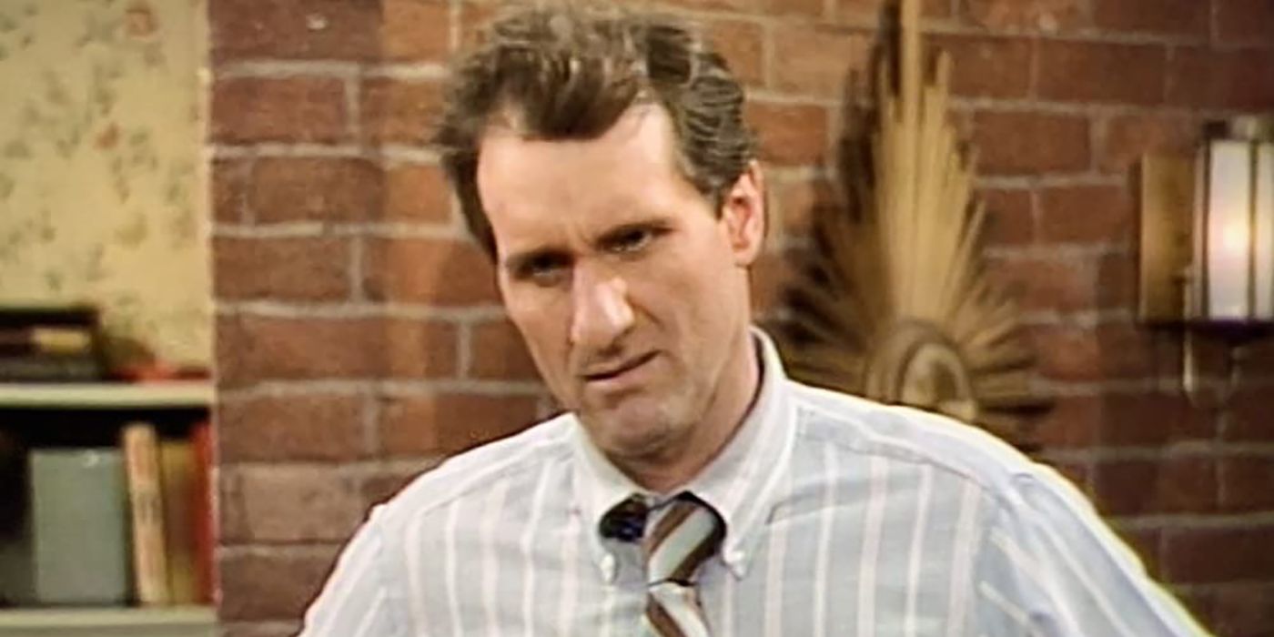 al bundy from married with children with a grumpy look on his face, standing in the living room.