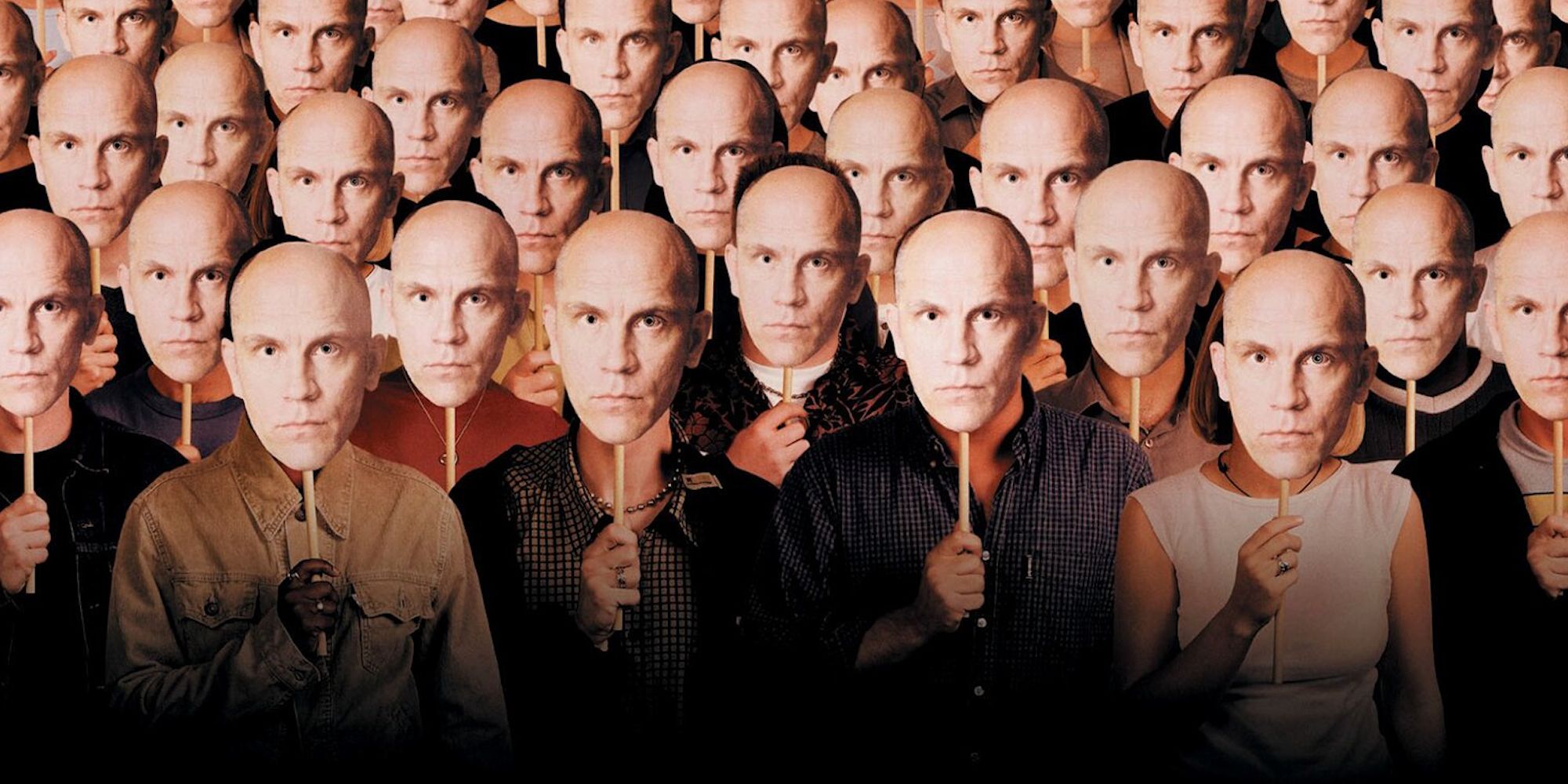 People holding a John Malkovich mask in front of their faces in Being John Malkovich