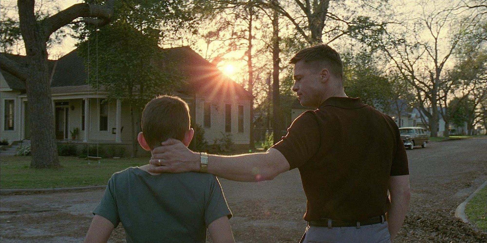 Brad Pitt and Hunter McCracken as Mr. O'Brien nad young Jack walking in 'The Tree of Life'