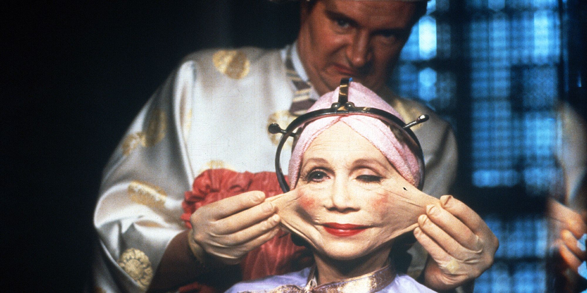 Jim Broadbent stretching Katherine Helmond's face in Brazil.