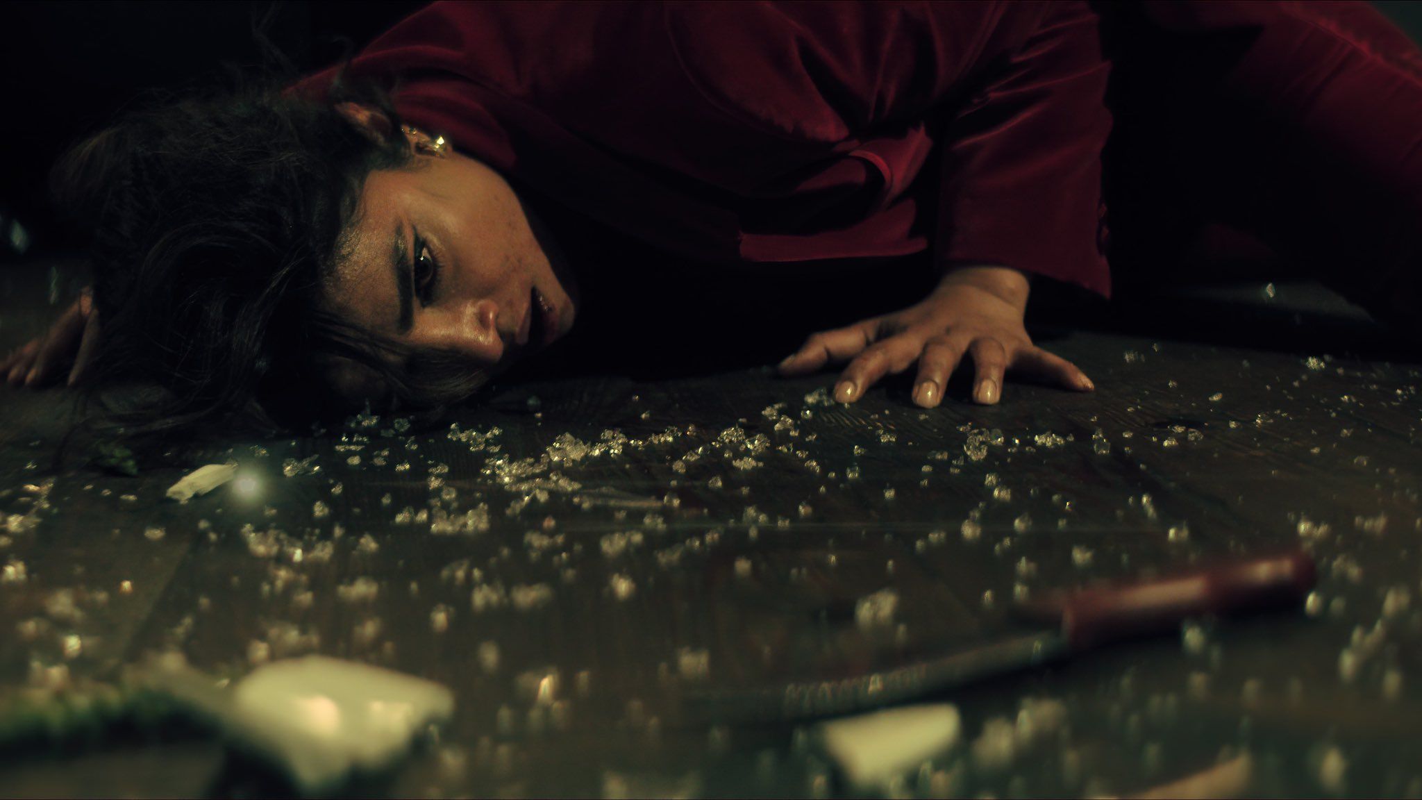Priyanka Chopra laying on a floor covered in glass in Citadel