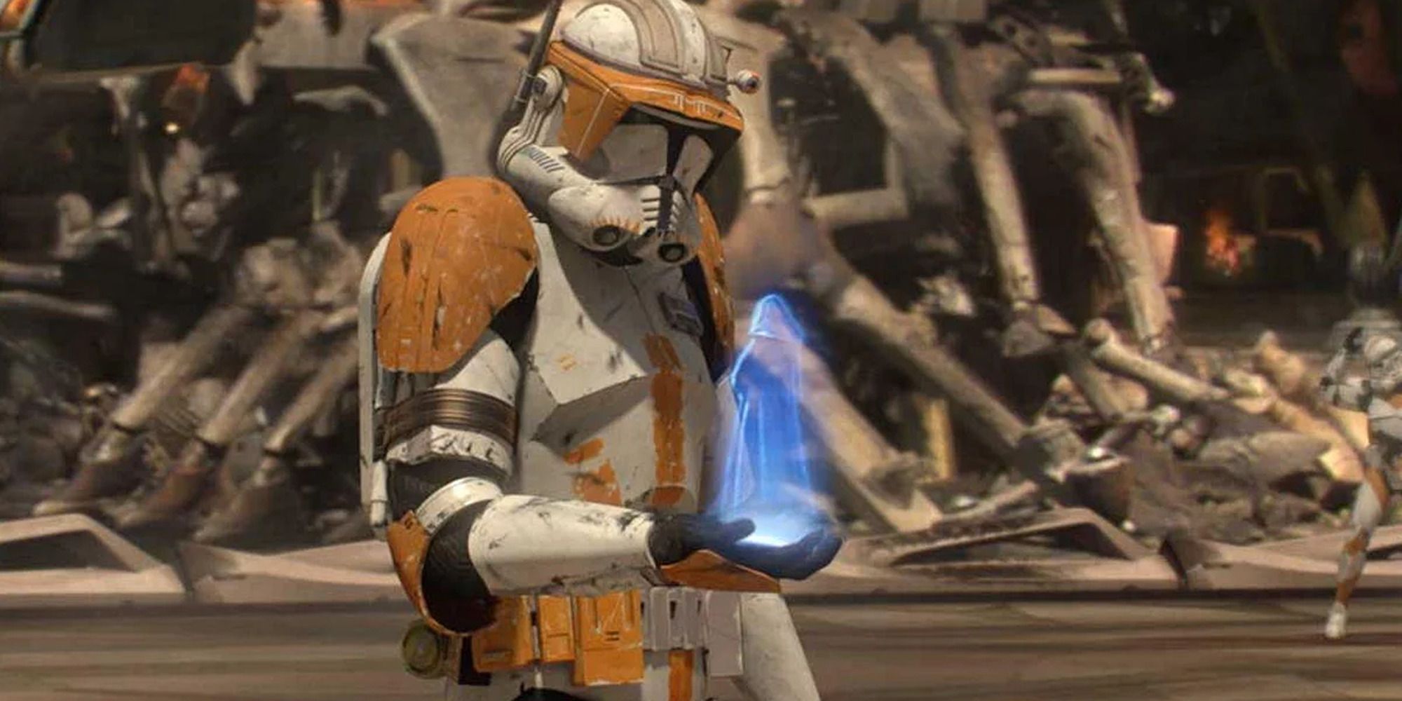 clone trooper in yellow armor looking at sinister hologram in battlefield