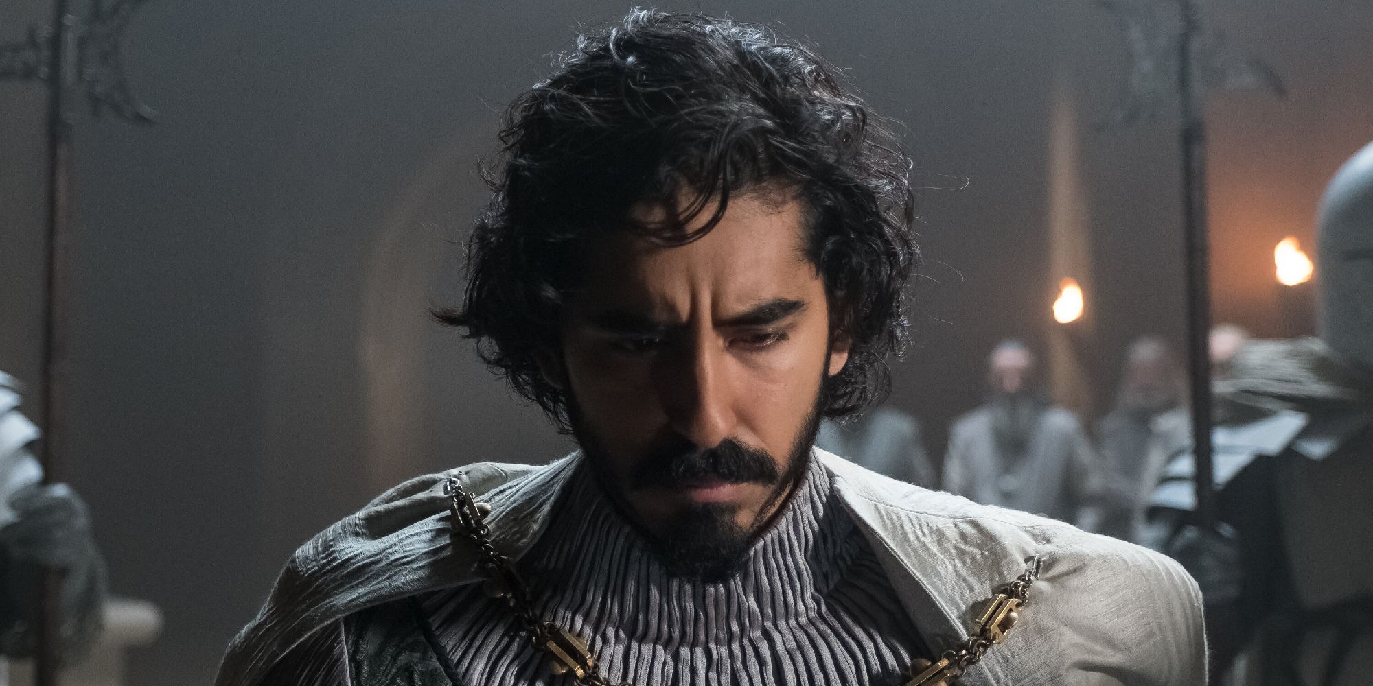 Dev Patel looking down in 'The Green Knight'