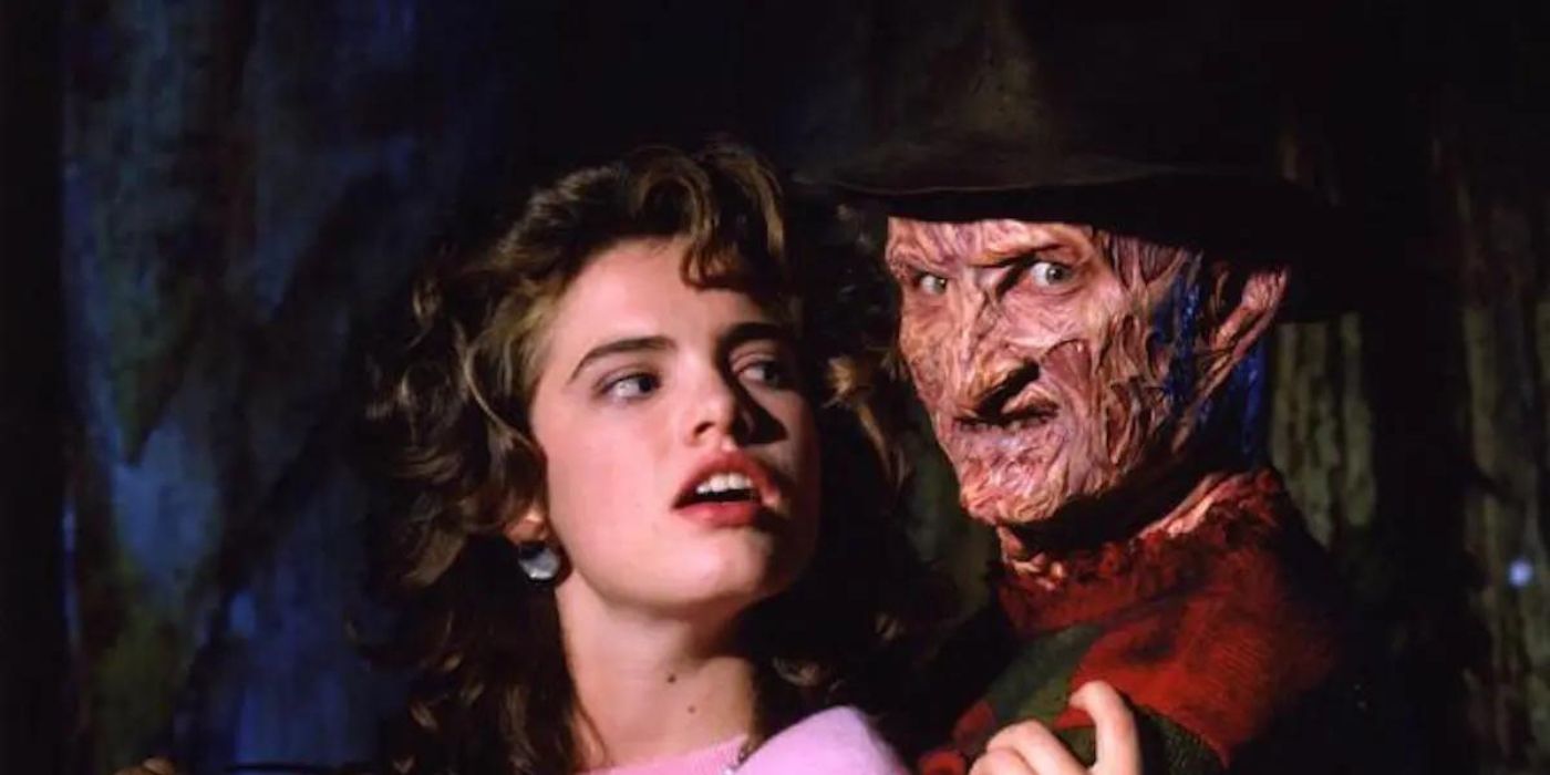 Le Freddy de Robert Englund tenant dans ses bras la Nancy Thompson de Heather Langenkamp dans 'Les cauchemars de Elm Street 3 : Les guerriers des rêves'.