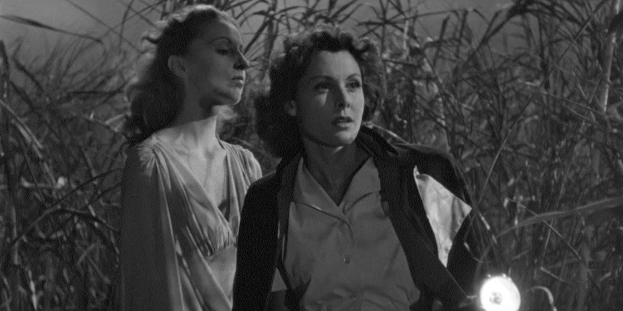 Edith Barrett and Frances Dee walk through brush in I Walked With A Zombie