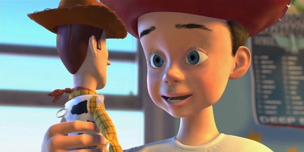 Andy tenant dans ses bras Woody dans 'Toy Story' (1995)