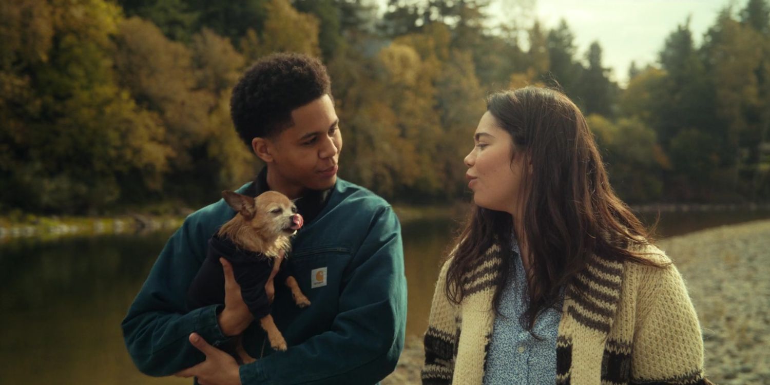 Amber and Ty speaking near a lake