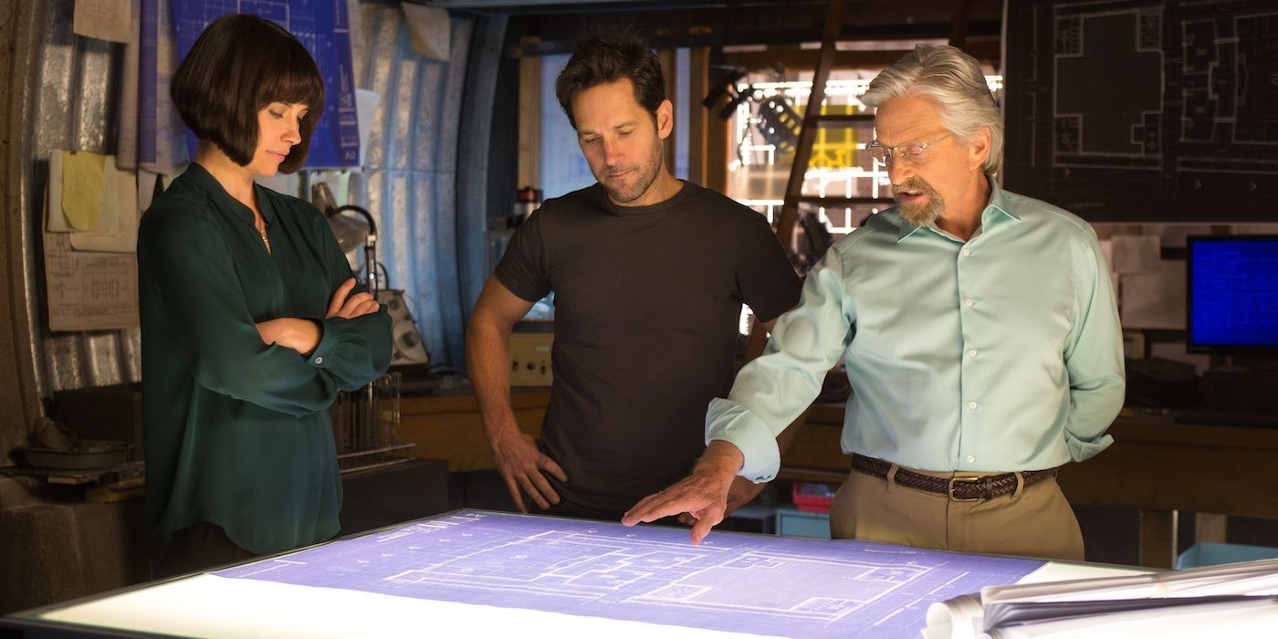 Hope (Evangeline Lilly), Scott (Paul Rudd), and Hank (Michael Douglas) looking at a map in Ant-Man (2015).
