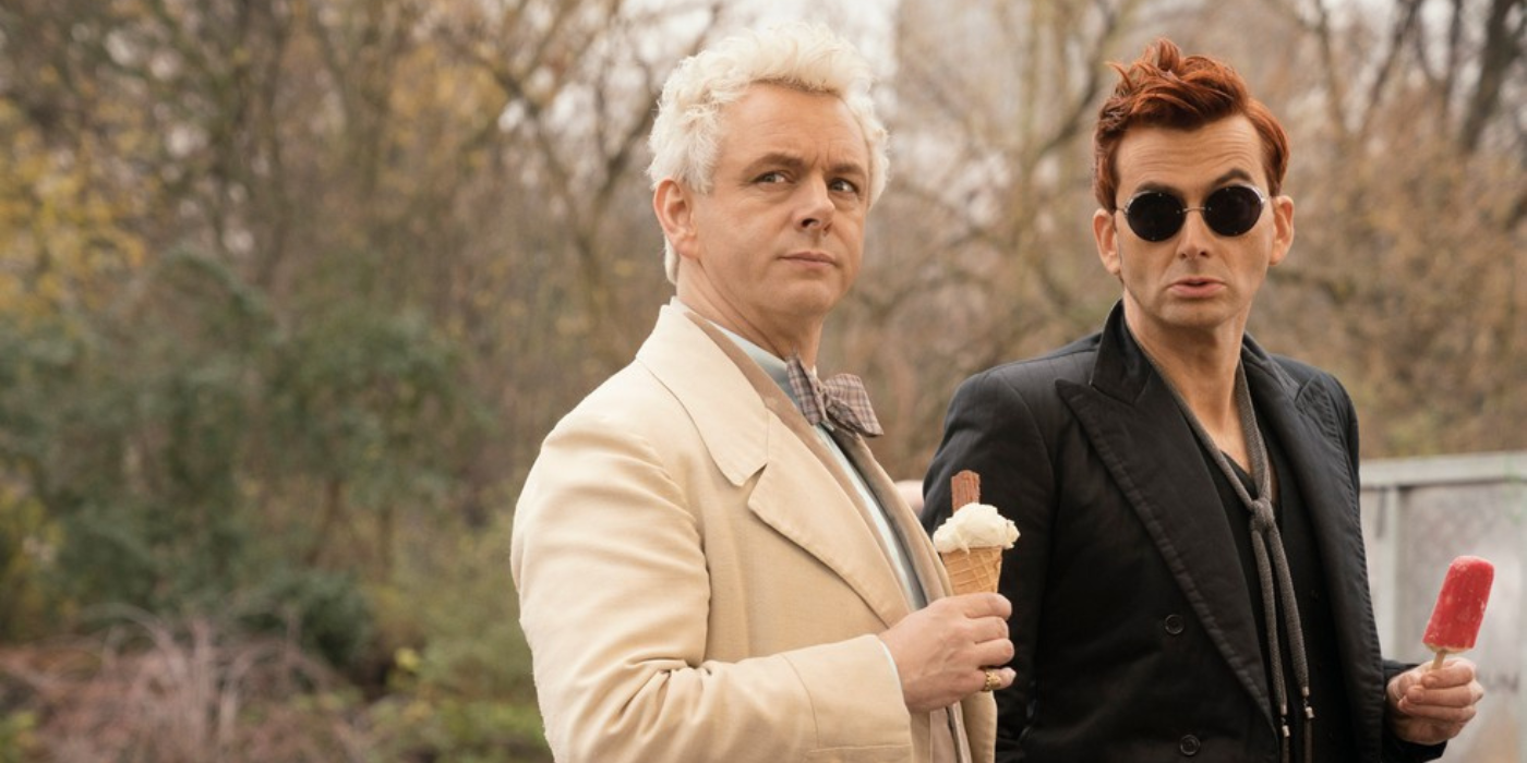 David Tennant and Michael Sheen in Good Omens eating an ice cream and popsicle while looking up at something.
