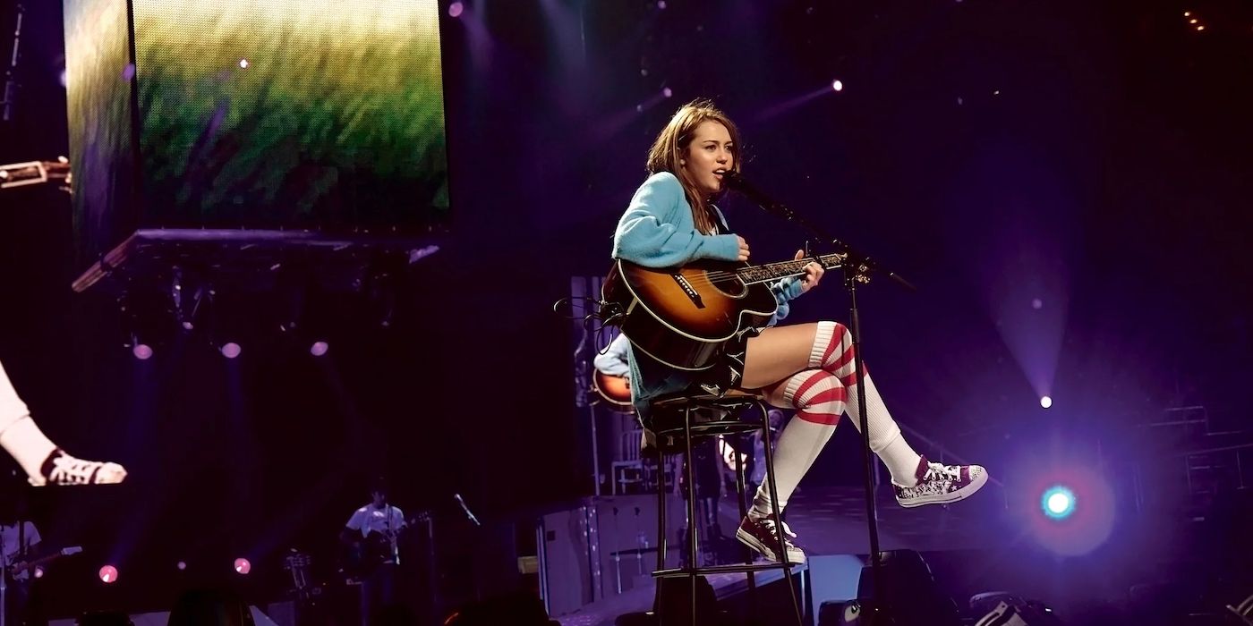 Miley Cyrus playing guitar at the Hannah Montana and Miley Cyrus: Best of Both Worlds concert