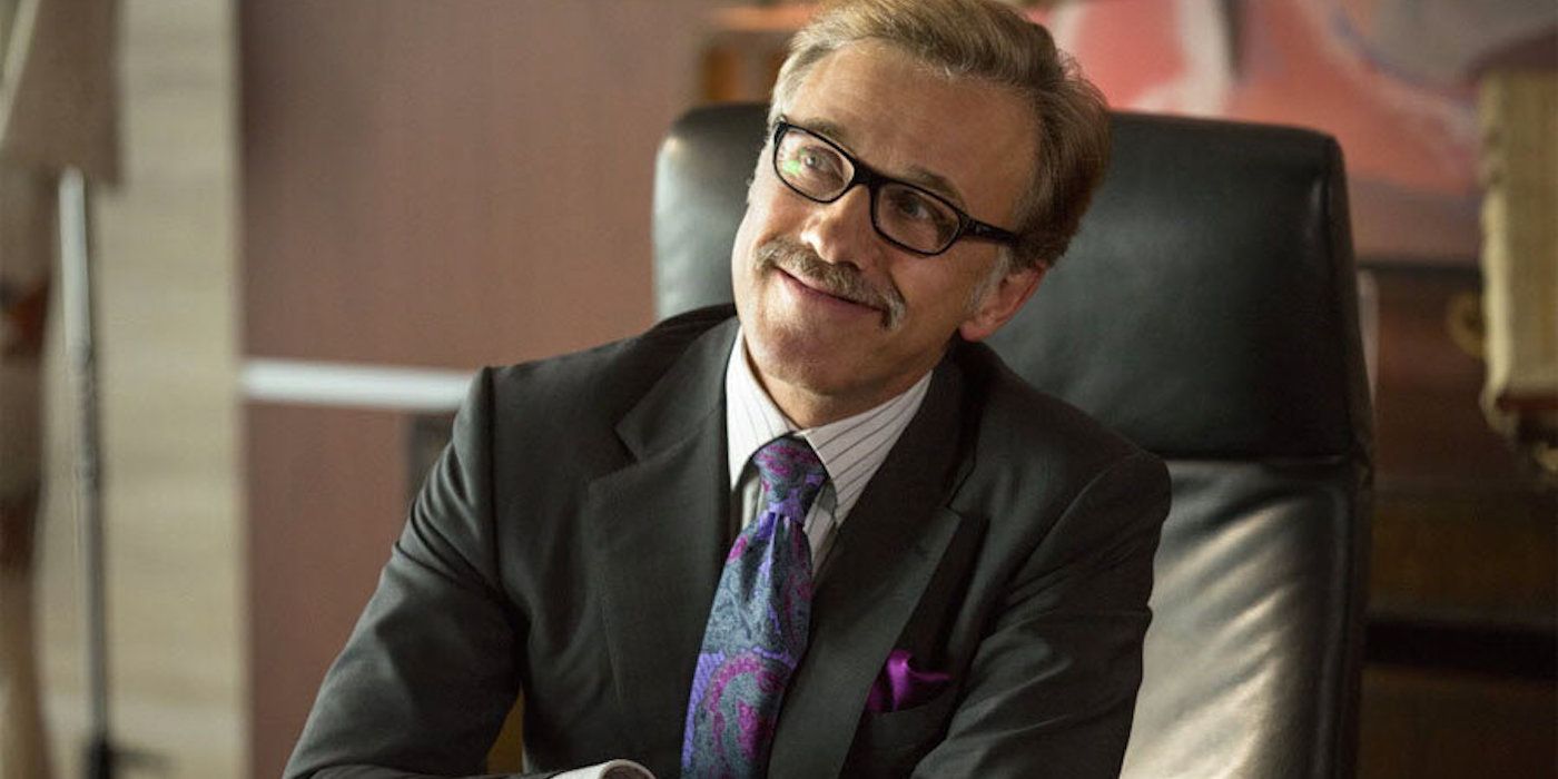 Christoph Waltz as Bert Hanson sitting at a desk in Horrible Bosses 2