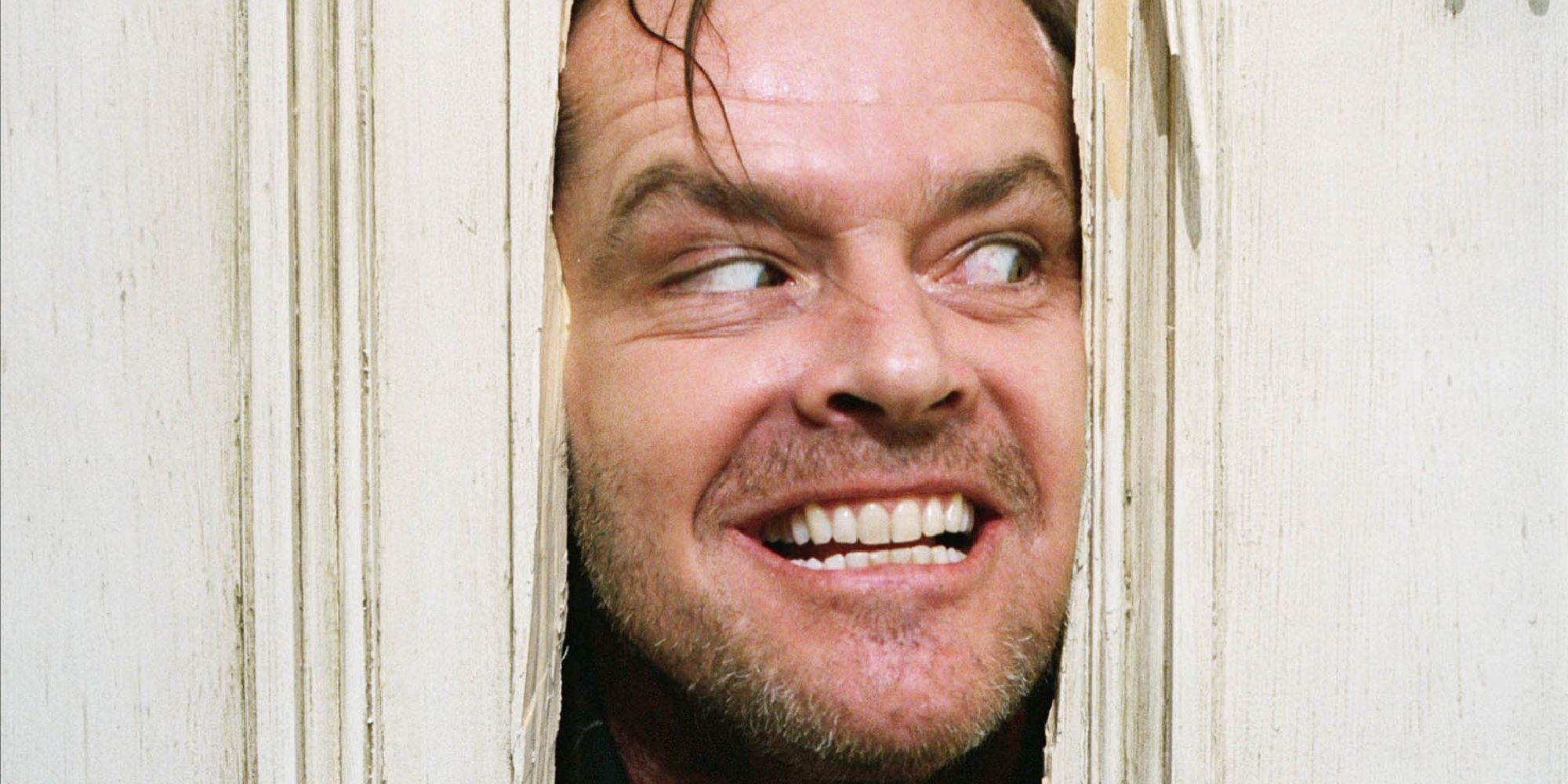 Jack Nicholson looking through a door in 'The Shining'.