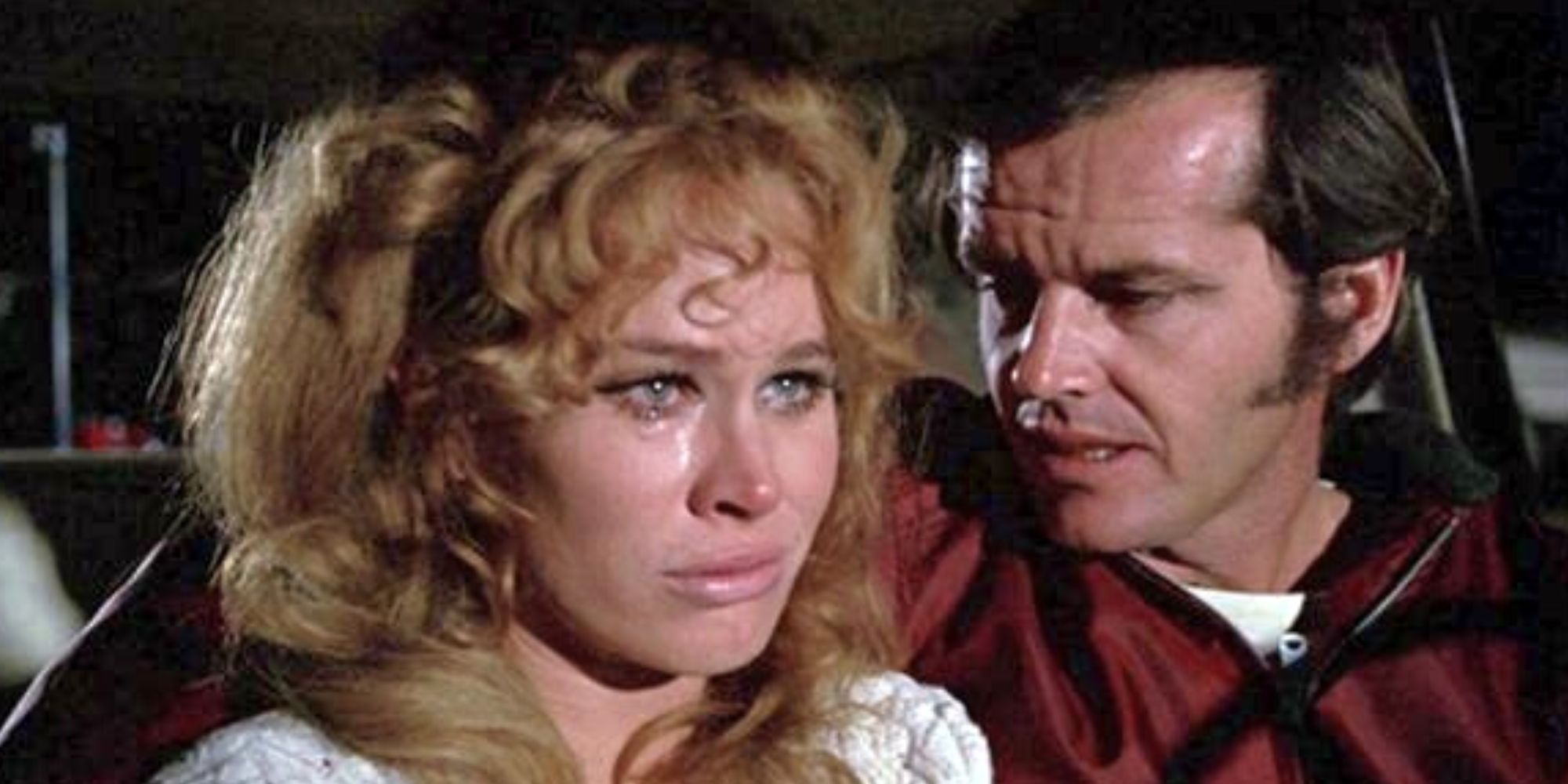 Jack Nicholson sitting next to Karen Black in the front seat of a car in Five Easy Pieces