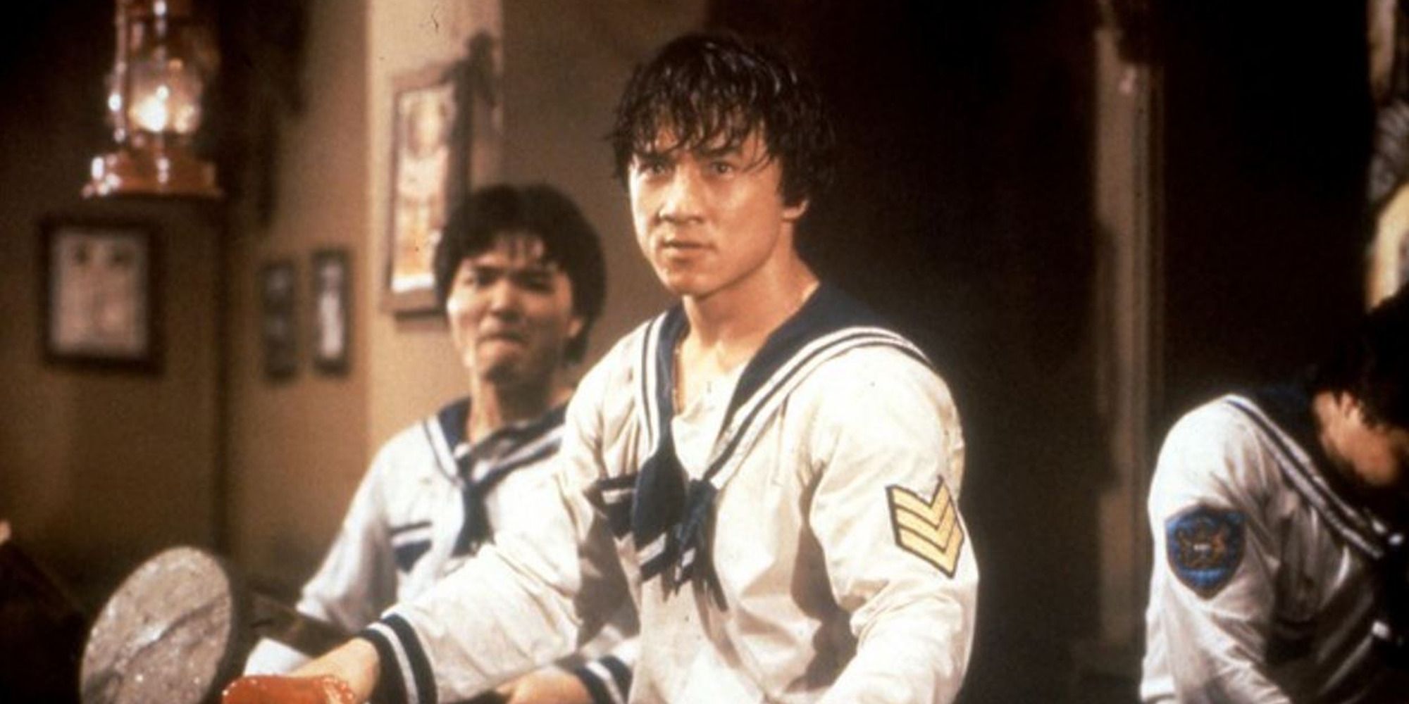 Jackie Chan in a sailor uniform getting ready to fight in 'Project A'