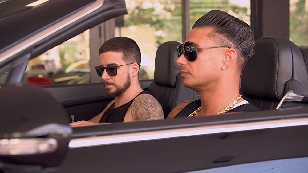 Vinny Guadagnino and DJ Pauly D riding in a car on Jersey Shore Family Vacation