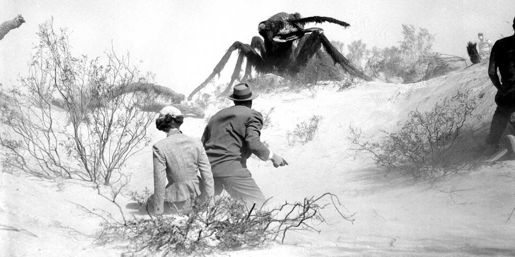 A giant ant approaches two humans in Them!