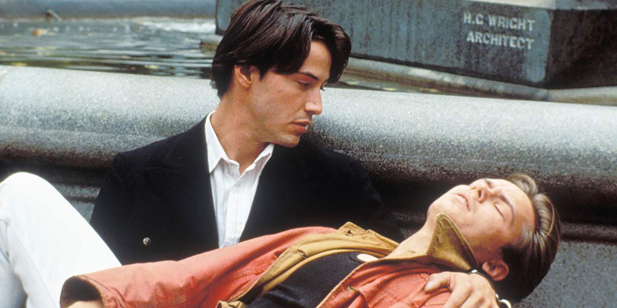 Keanu Reeves holding River Phoenix in My Own Private Idaho