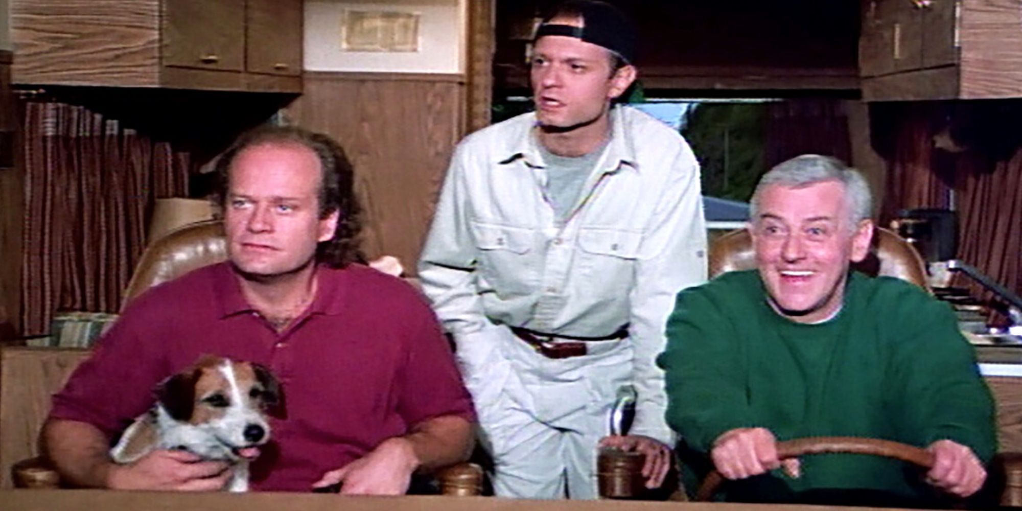 Kelsey Grammer sitting in the front seat of an RV while David Hyde Pierce stands between him and John Mahoney driving inFrasier