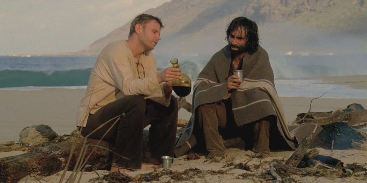 Mark Pellegrino and Nestor Carbonell drinking on a beach in Lost