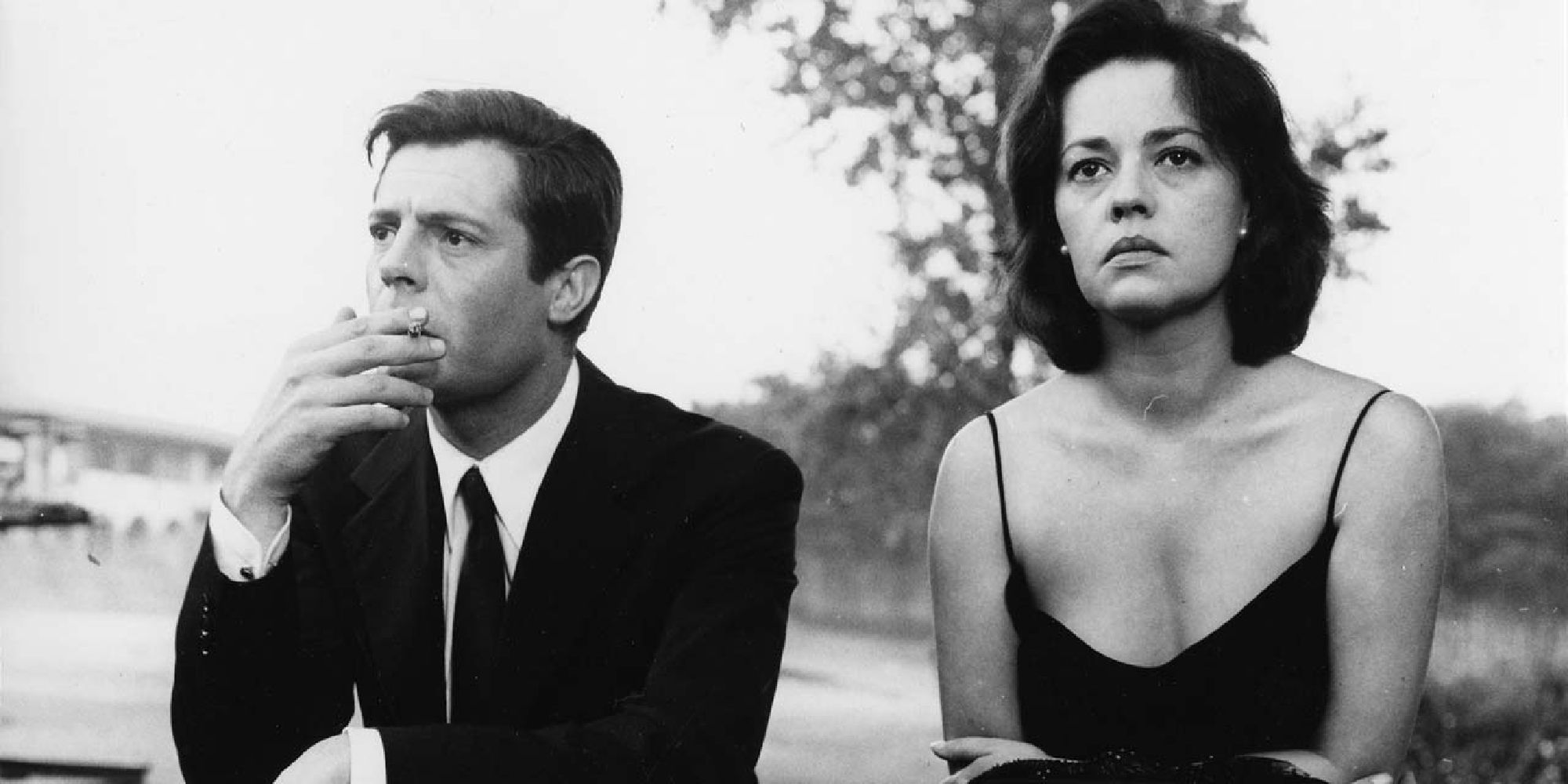 Marcello Mastroianni and Jeanne Moreau sitting side by side in 'La Notte'