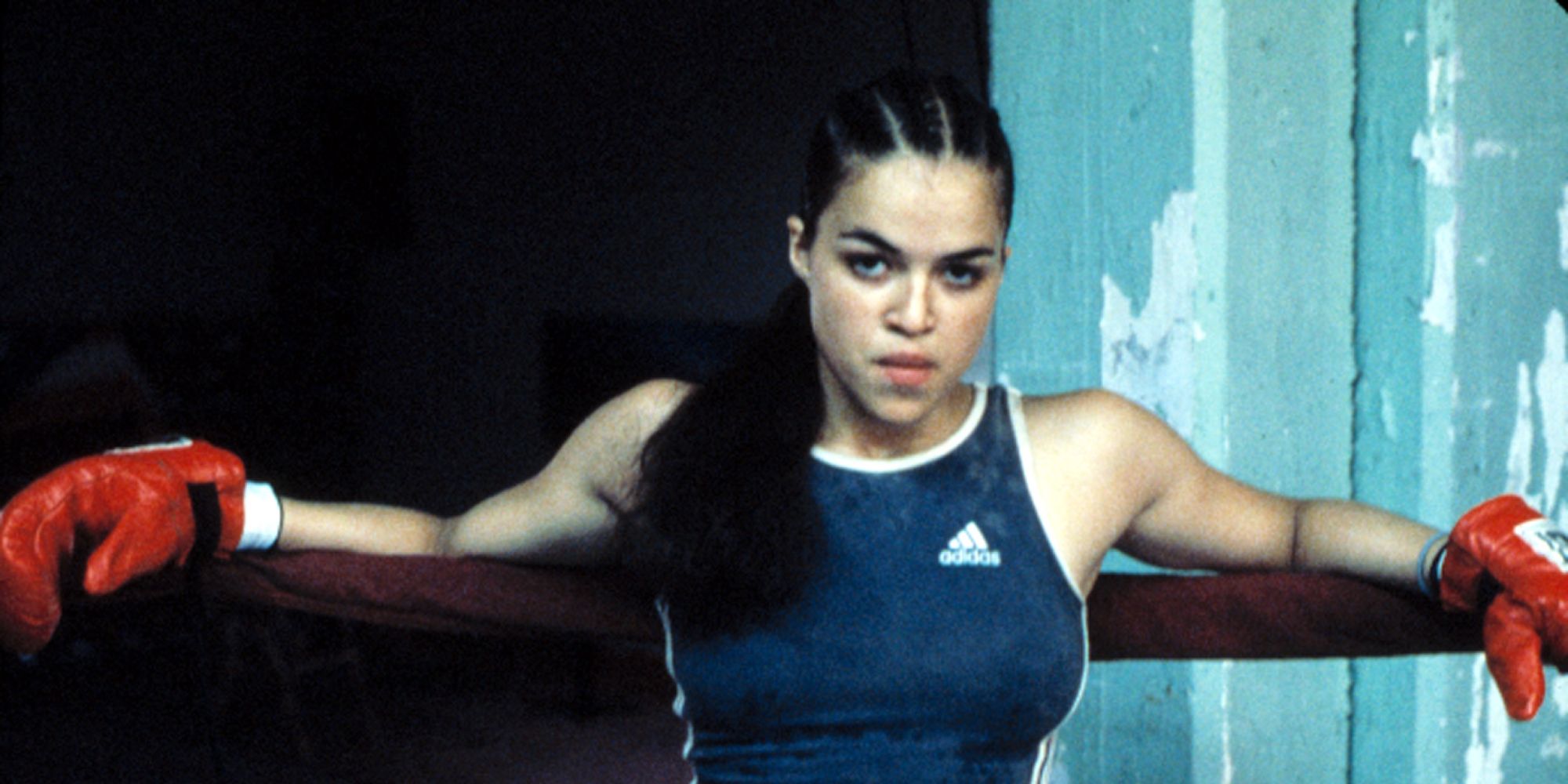 Michelle Rodriguez as Diana Guzman resting her arms in the boxing ring