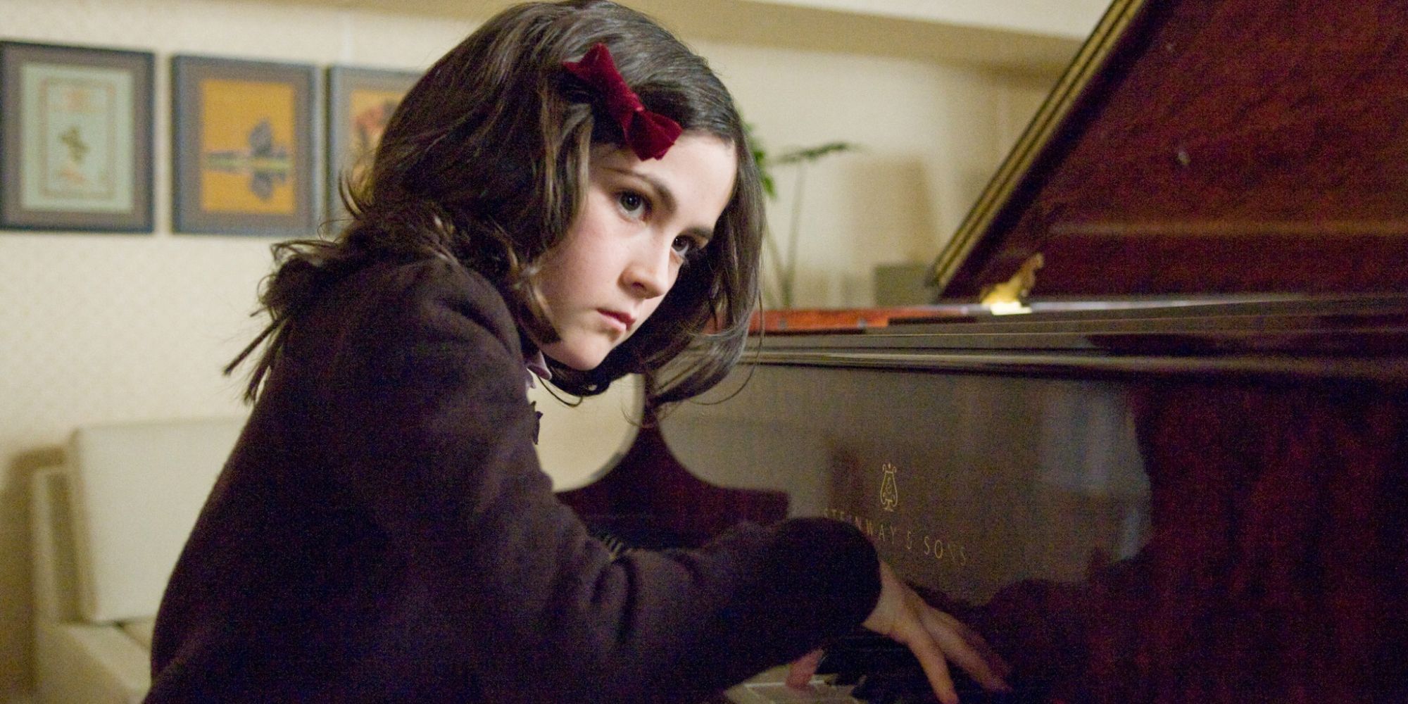 Esther (Isabelle Fuhrman) creepily playing the piano in Orphan (2009)