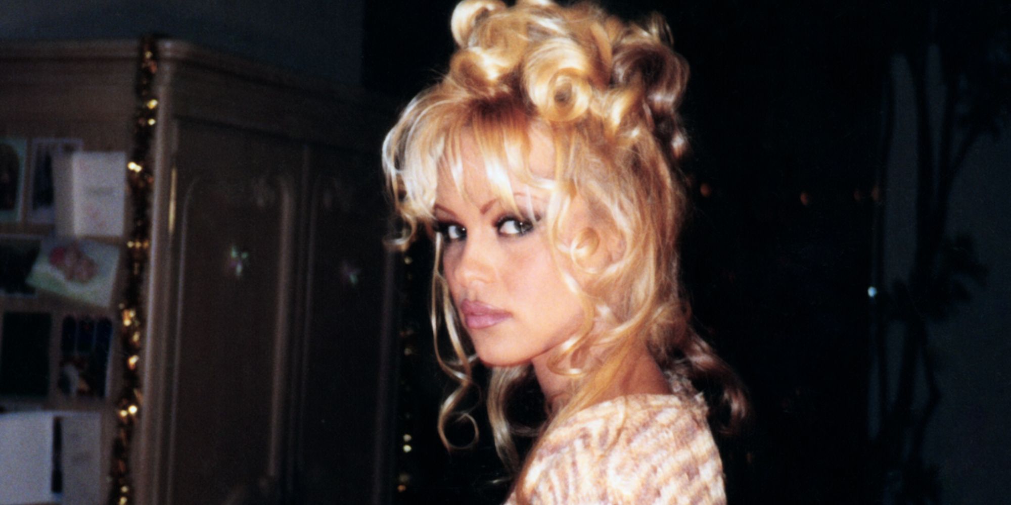 Pamela Anderson with her hair up during the '90s in 'Pamela, a Love Story'