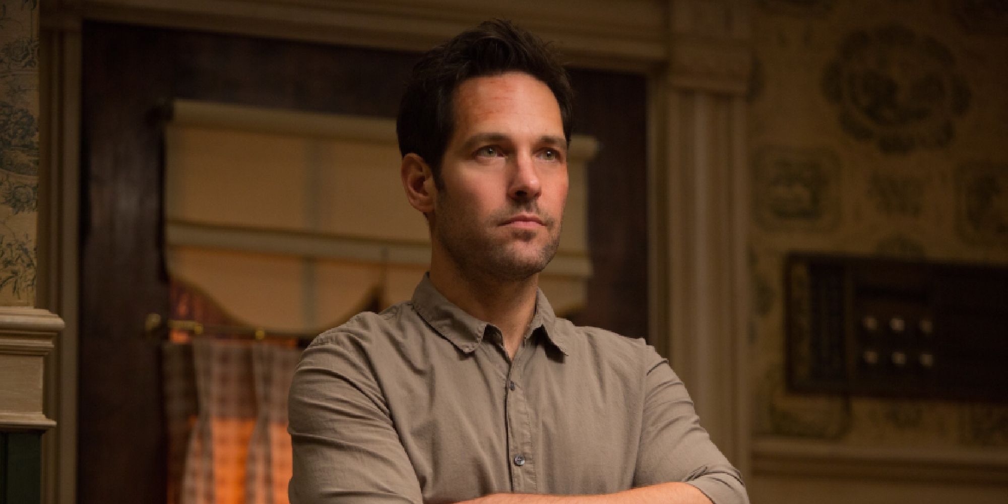Paul Rudd with his arms crossed as Scott Lang 