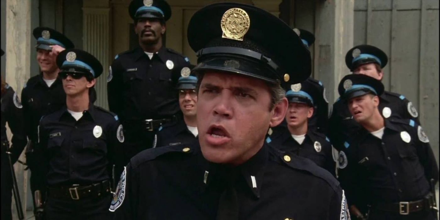 G.W. Bailey as Lt. Harris, looking confused along with a group of cops standing behind him in Police Academy