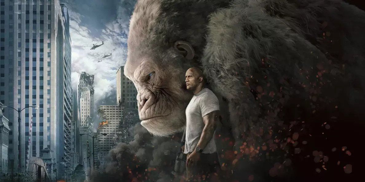 Image promotionnelle du film Rampage (2018) mettant en scène Dwayne Johnson et un gorille géant muté nommé George devant une ville détruite.