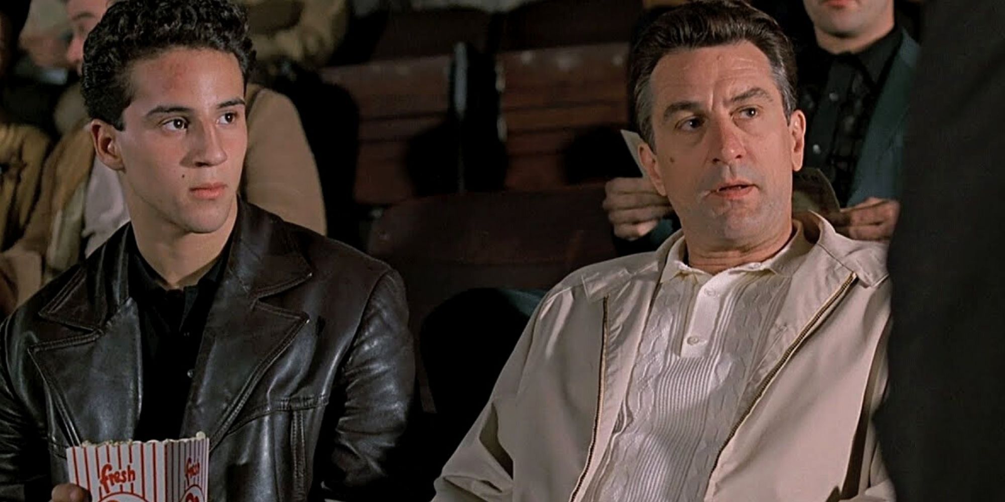 Robert De Niro sitting next to Lillo Brancato in A Bronx Tale