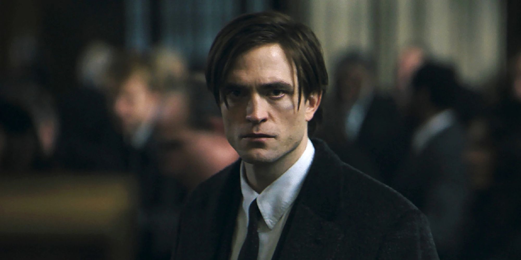 Robert Pattinson looking at the camera as Bruce Wayne in 'The Batman'