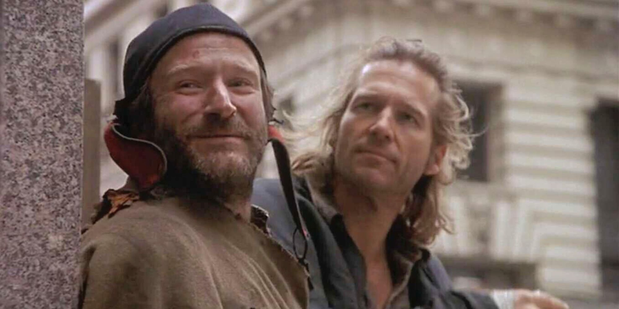 Robin Williams standing next to Jeff Bridges in The Fisher King