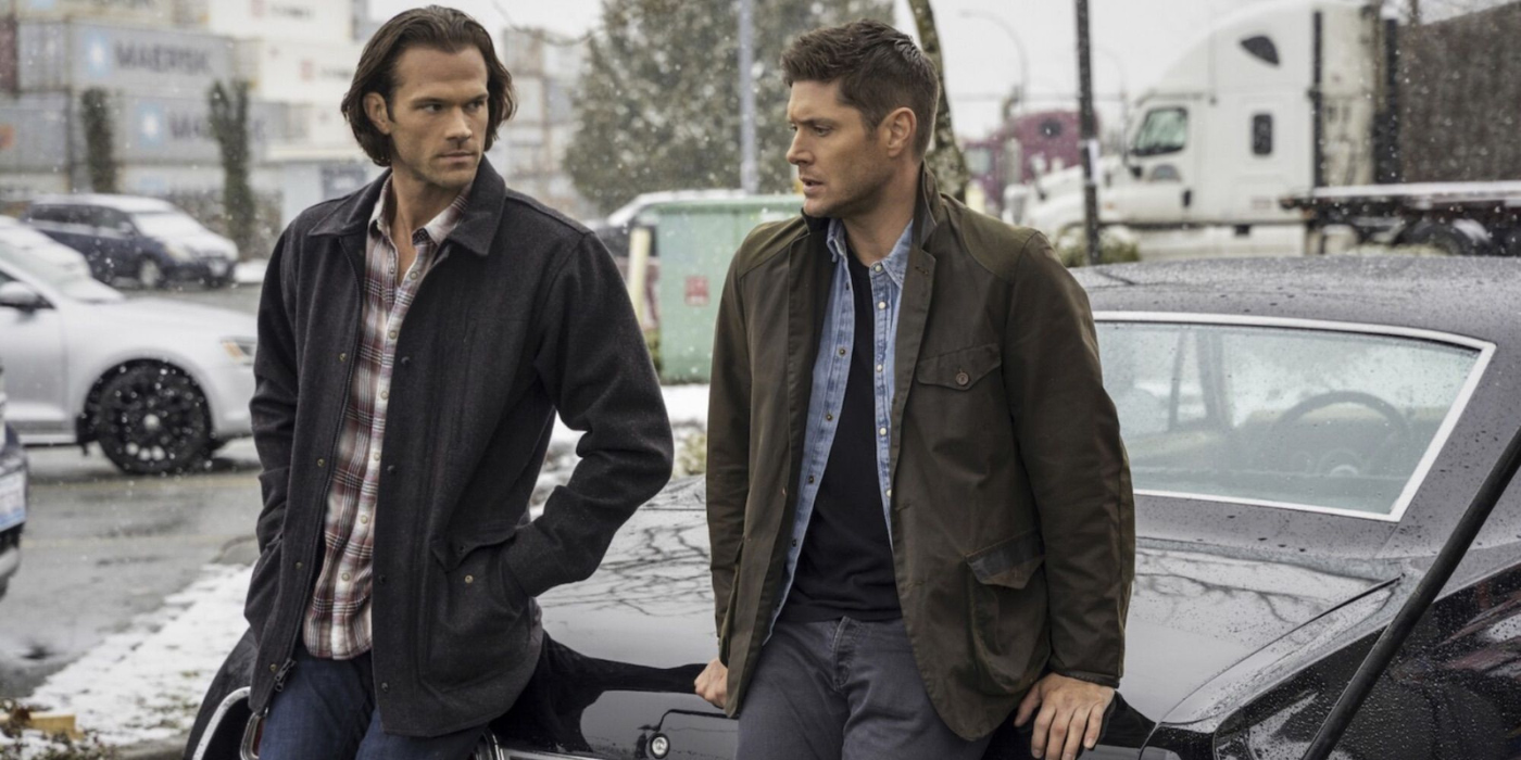 Jared Padalecki and Jensen Ackles sit on the hood of their car in Supernatural  