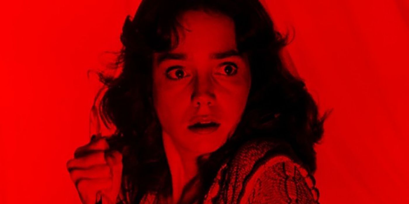 a red-tinted Jessica Harper against a red background in Dario Argento's Suspiria