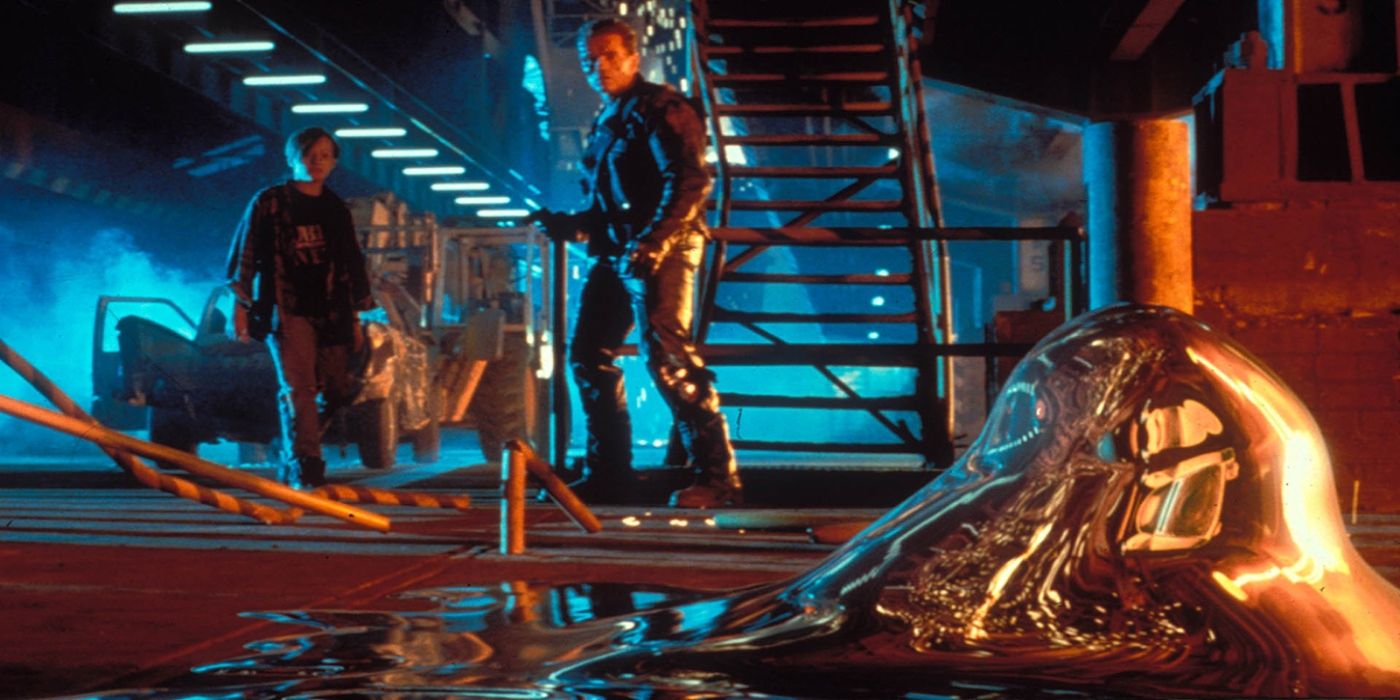 Arnold Schwarzenegger as the Terminator and Edward Furlong as John Conner watching the T-1000 regenerate in Terminator 2 Judgement Day