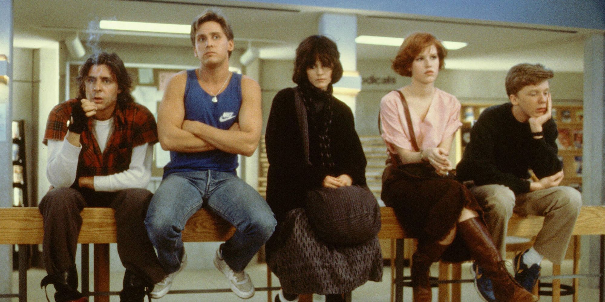 Members of the Brat Pack sitting on a bench in 'The Breakfast Club'