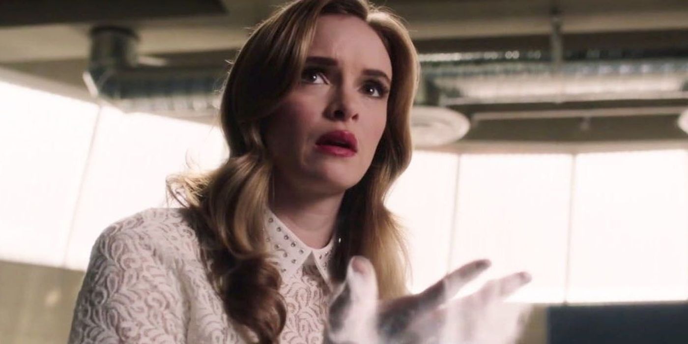 Danielle Panabaker's Caitlin Snow looking worried as frost comes out of her hand on The Flash.