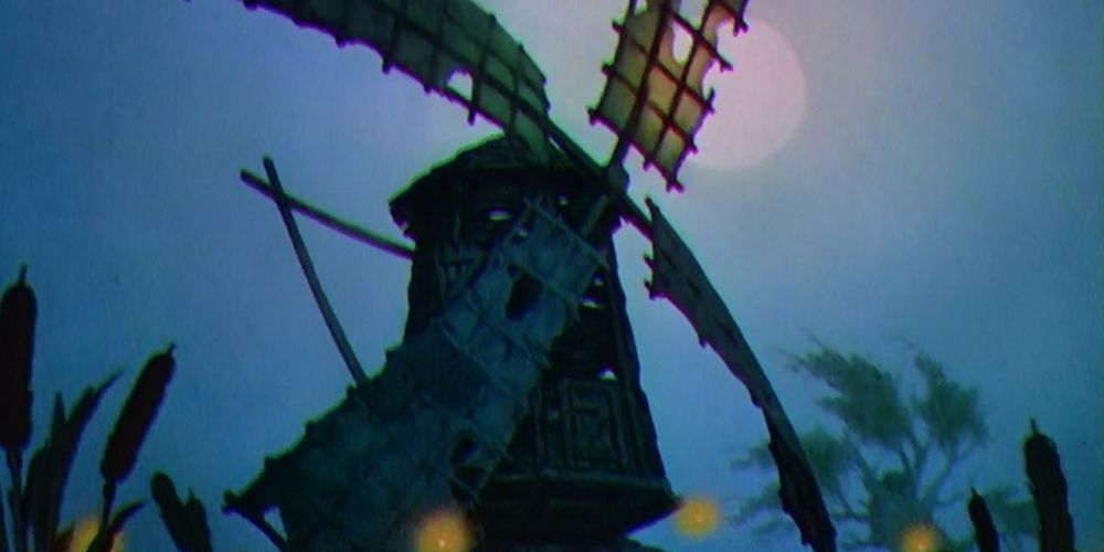 Le vieux moulin silhouetté par la lune