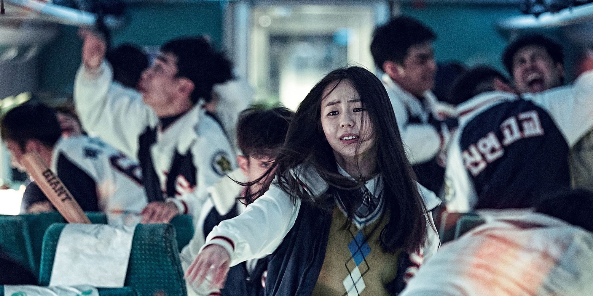 Passengers on a train scrambling as a zombie virus breaks out in 'Train To Busan'
