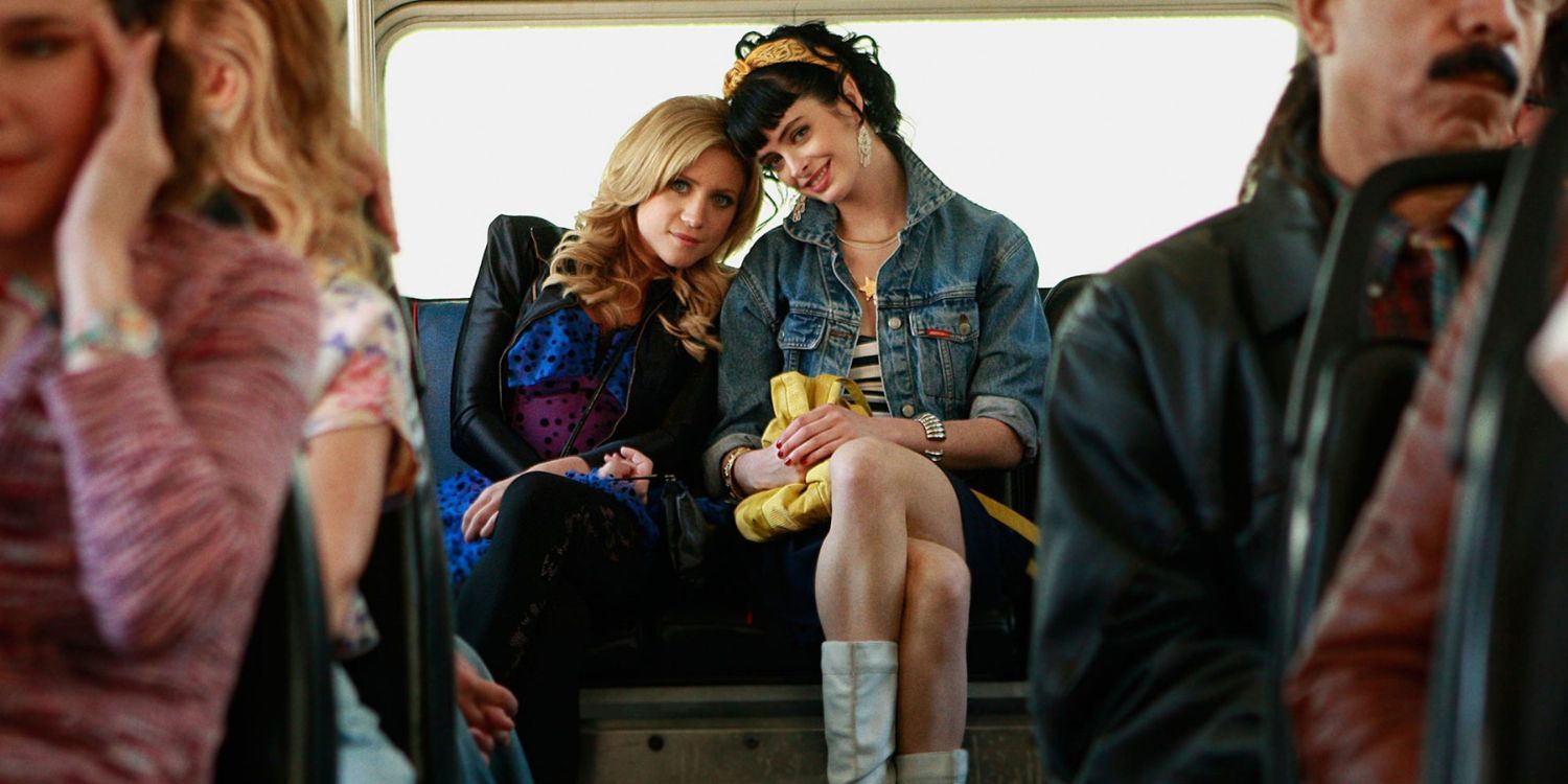 Lily and Carol on a bus in a flashback
