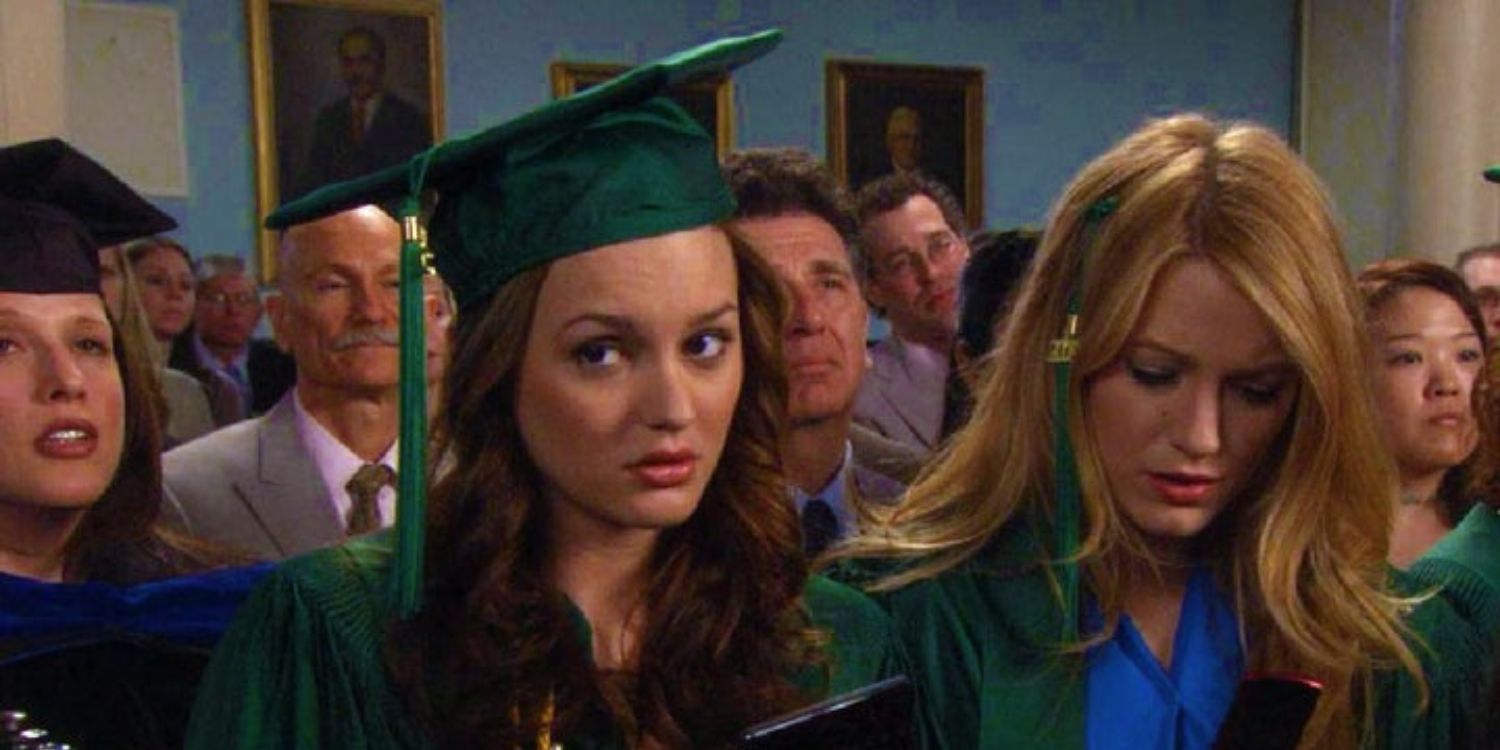 Serena looks at her phone, Blair looks to the right in their graduation gowns
