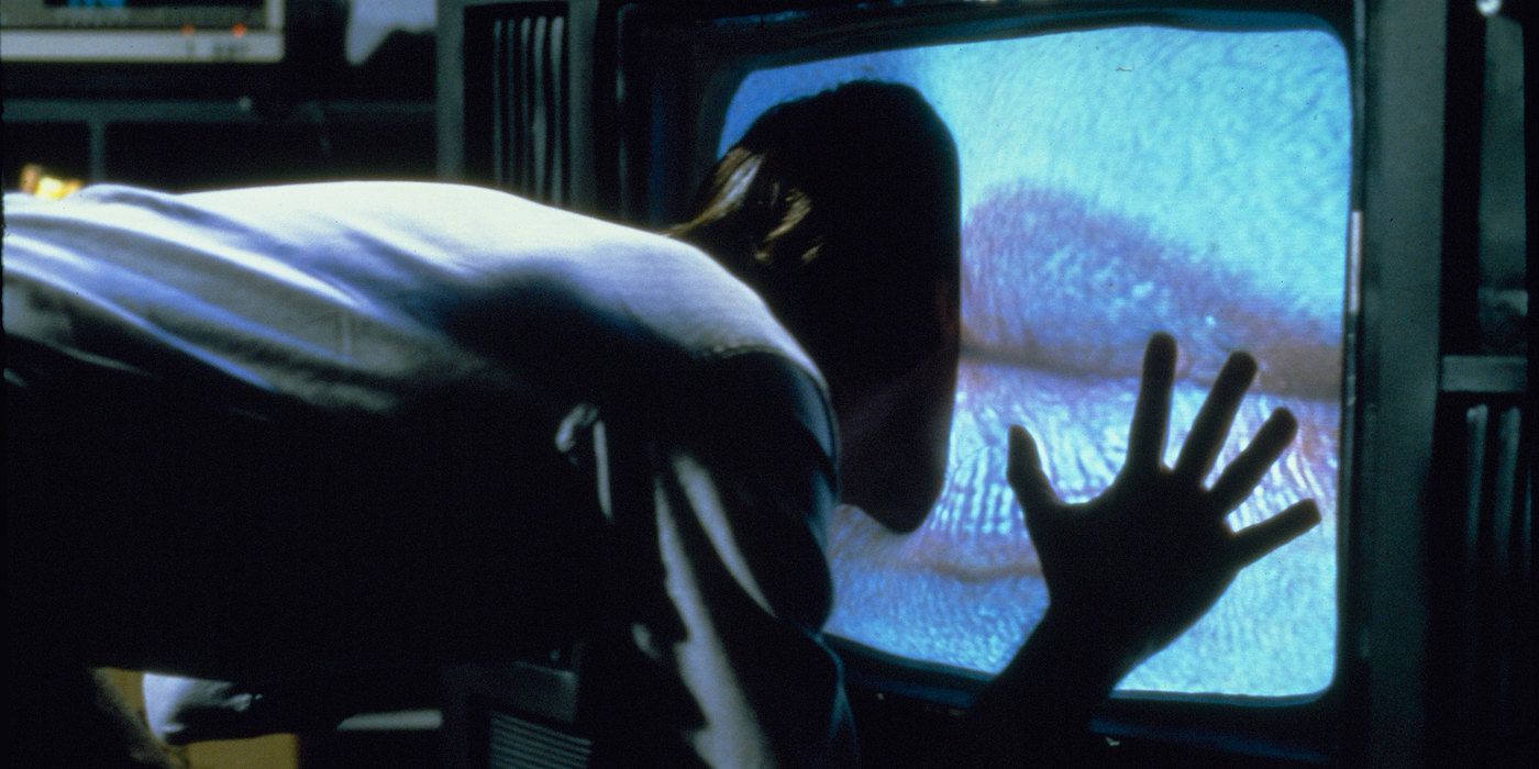 James Woods putting his head on a TV at Videodrome