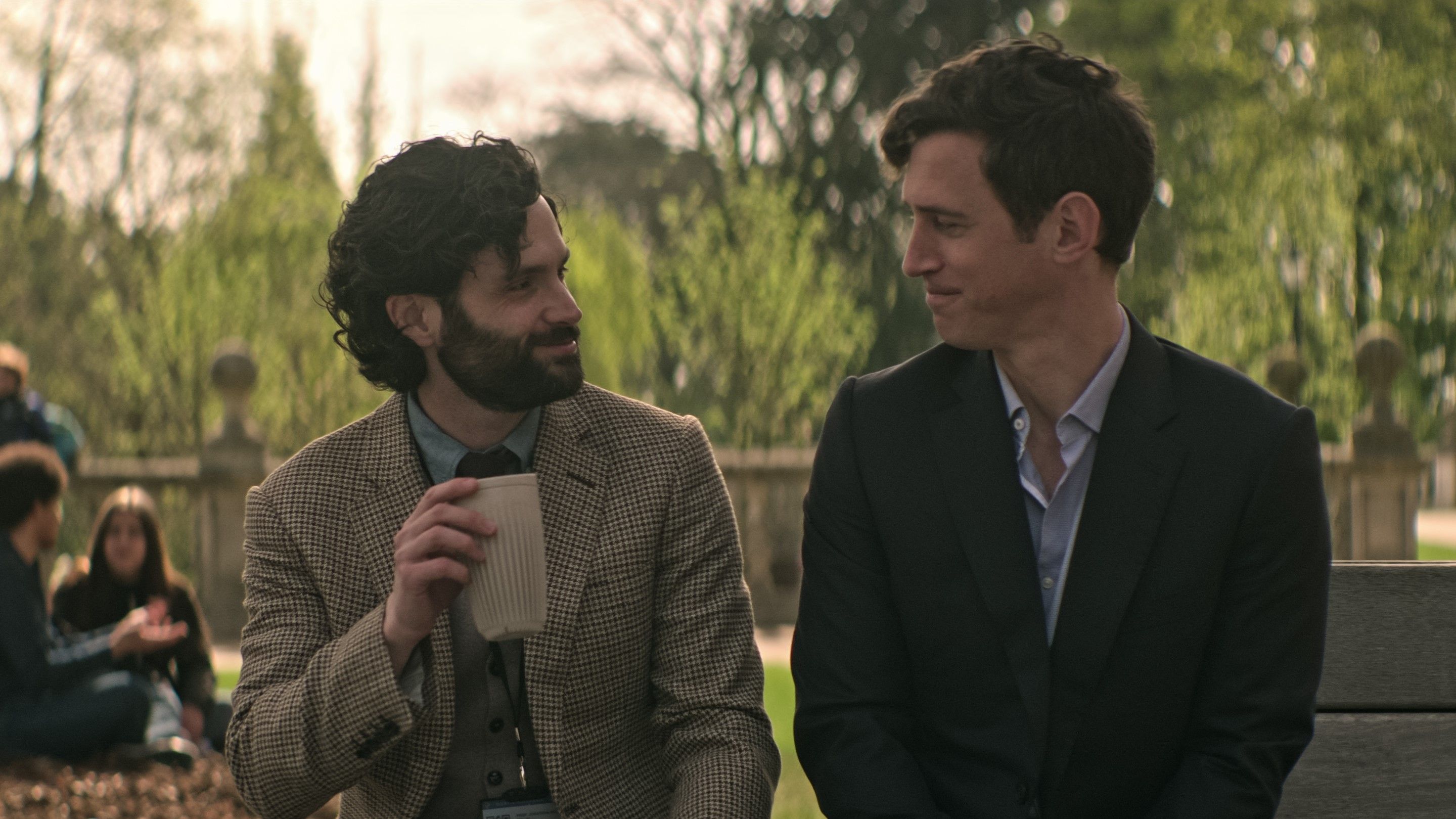 Penn Badgley and Stephen Hagan in a scene from Season 4, Episode 1 of YOU. 