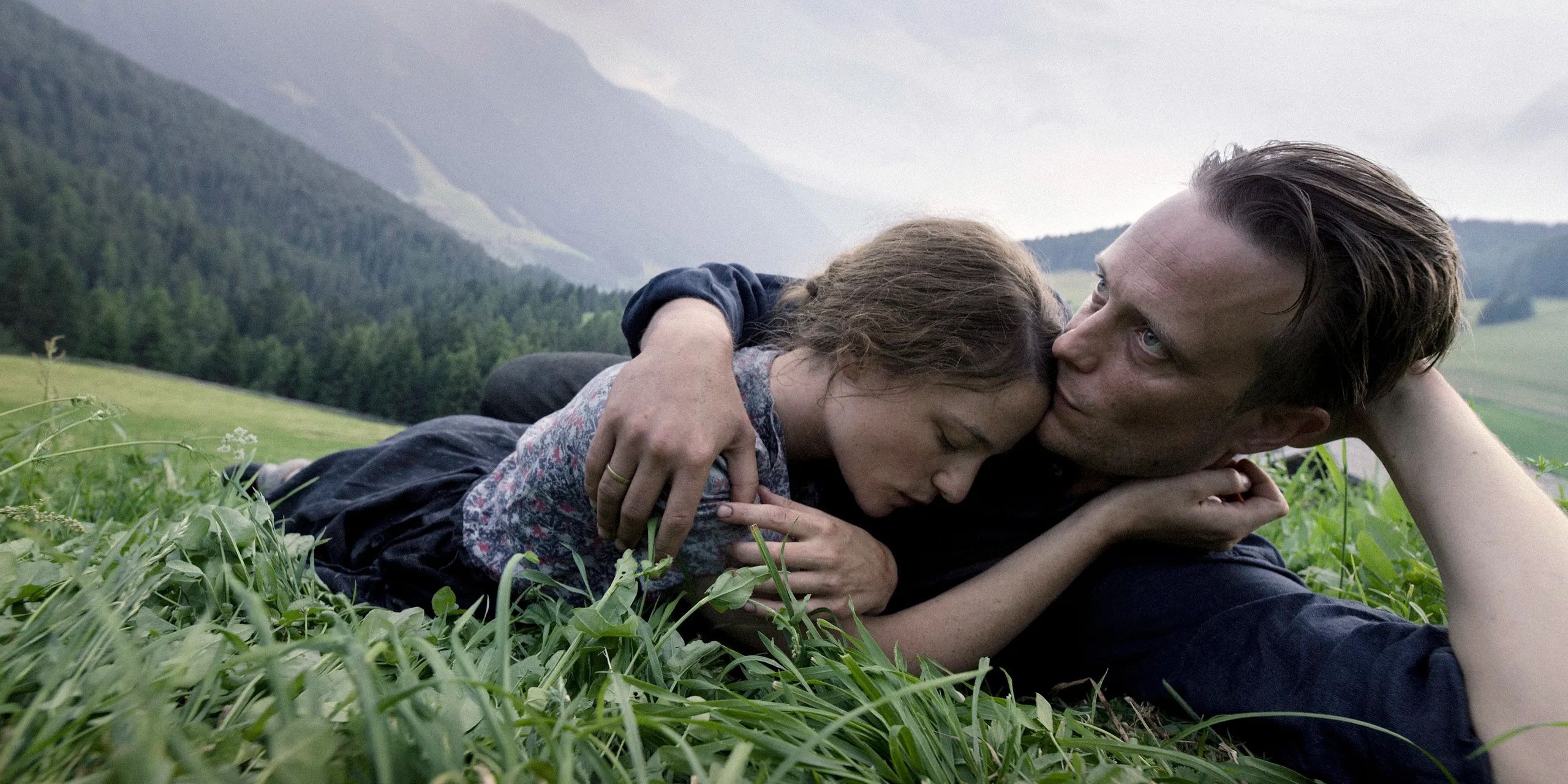 Franz and Franziska lay in grass together in A Hidden Life 