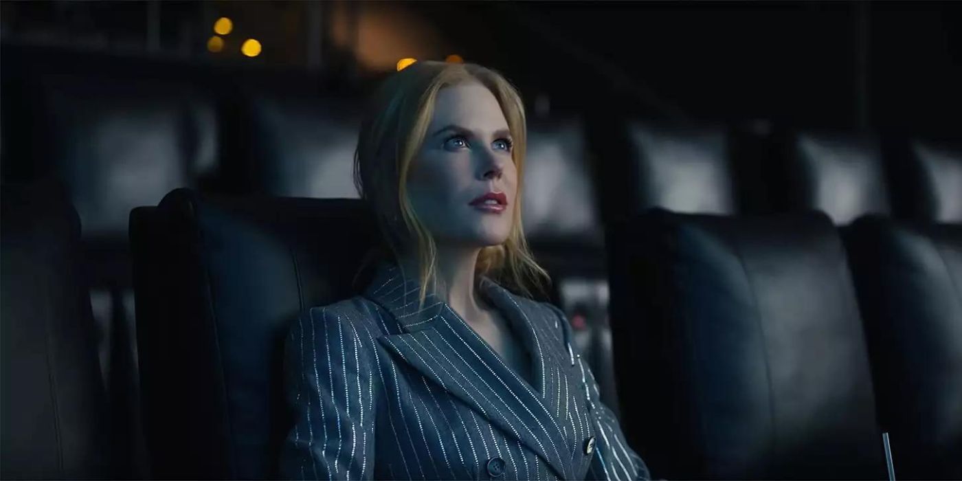 Nicole Kidman sitting in an empty theater looking up at the screen in awe in the AMC theaters ad
