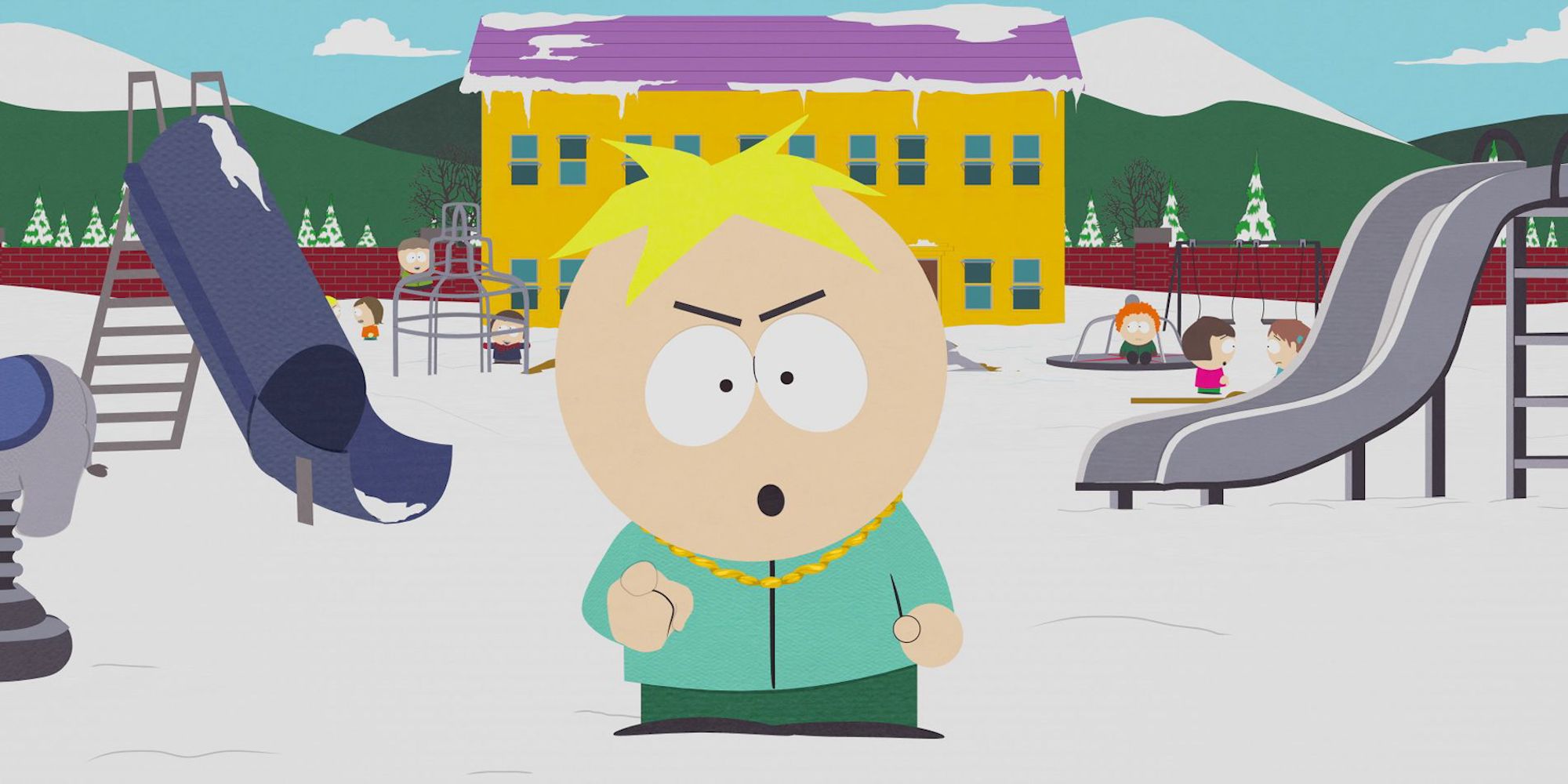 A pimped out Butters stands in the school playground with an angry scowl on his face.